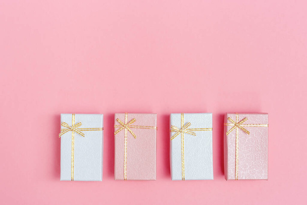 Pink and White presents for Valentines day, Womans Day, Boxing Day. Closed boxes with surprise. Minimal style holiday background pastel colored. - Foto, immagini