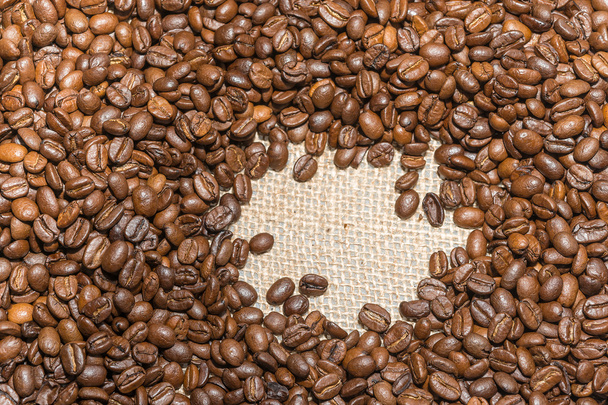Café torréfié grains fond sur toile de jute texture
 - Photo, image