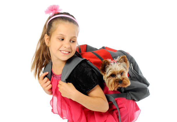 Schoolgirl and cute puppy - Photo, Image