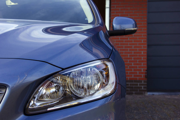 The headlight of a modern luxury blue car - Φωτογραφία, εικόνα