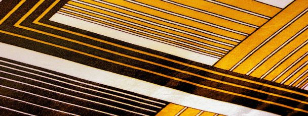 黄色の縞模様の絹織物。メキシコの動機を持つポンチョ。テクスチャ背景 - 写真・画像