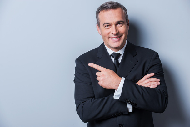 Mature man in formalwear pointing away - Photo, Image