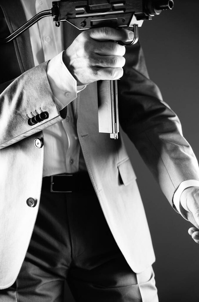 Retro secret agent with porstol revolver gun in hand in vintage crime thriller mockup cover     photo.        - Photo, Image