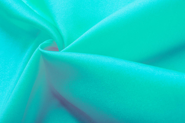 Bright turquoise silk chiffon, fluttering in the wind like a daisy, shines like heaven. Smooth hand of this satin-faced chiffon blends perfectly with your design ideas - Photo, Image
