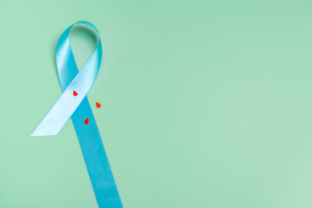 Concept for world diabetes day 14 november. Symbolic bow color raising awareness on diabetes day on light background. - Foto, immagini