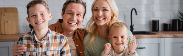 happy parents and sons smiling at camera at home in kitchen, banner - Foto, Imagem