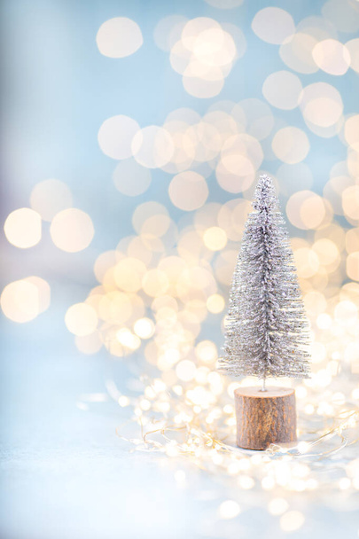 Christmas spruce with tree and blurred shiny lights. - Foto, imagen