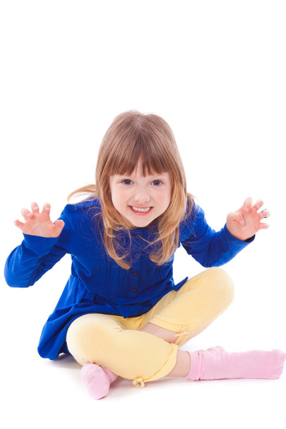 Blonde funny scaring little girl sitting - Foto, afbeelding