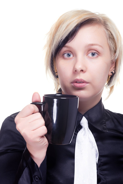 Young woman with cup of hot beverage - 写真・画像