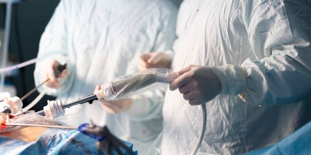 Medical instrument in the hands of a surgeon during laparoscopic surgery. - Photo, Image