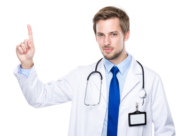 Kaukasische arts met vinger omhoog - Foto, afbeelding