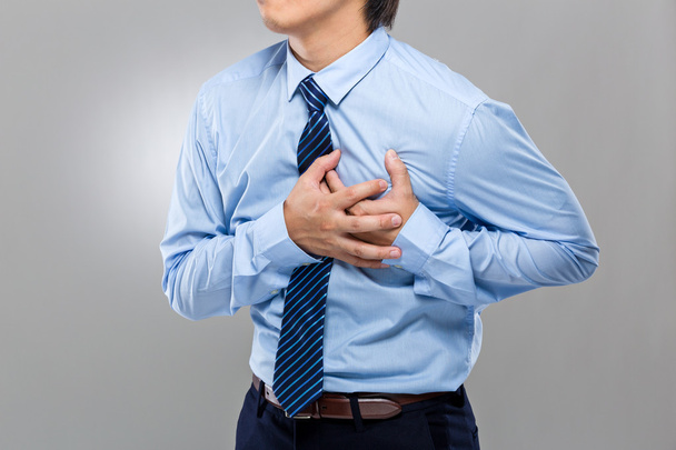 Homme d'affaires avec attaque cardiaque
 - Photo, image