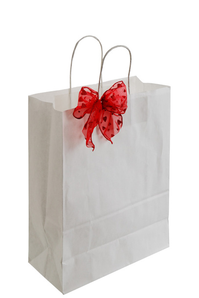 Bolsa de regalo de papel blanco con cinta roja
 - Foto, imagen
