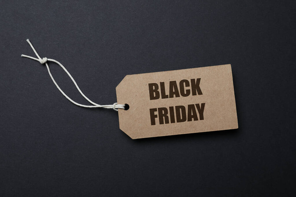 Tag with words Black Friday on dark background, top view - Фото, изображение