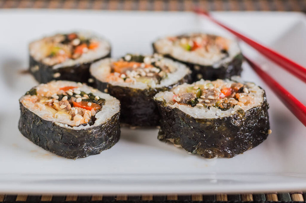 Cut kimbap or gimpab.Traditional Korean rolls with rice,beef,vegetables and omelette - Φωτογραφία, εικόνα