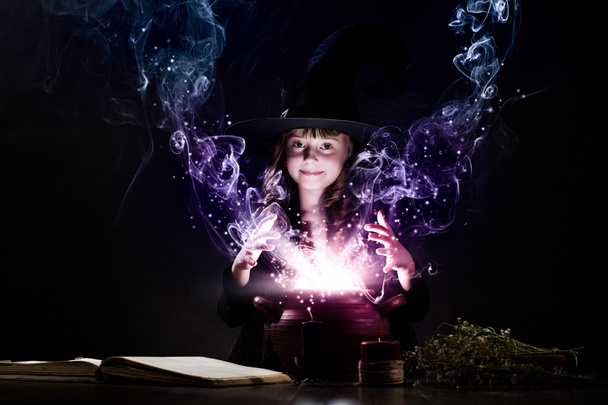 Little witch reading conjure - Zdjęcie, obraz