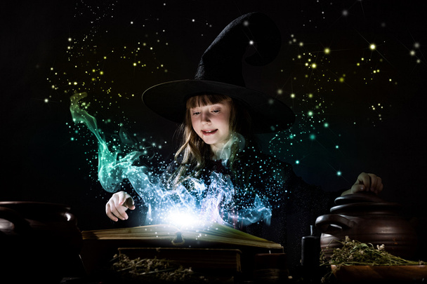 Little witch reading conjure - Fotografie, Obrázek