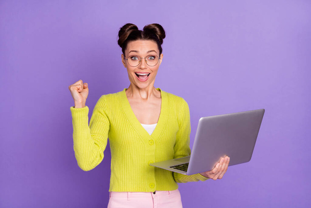 Photo portrait of woman in glasses keeping computer gesturing like winner browsing internet isolated on pastel purple color background - Valokuva, kuva