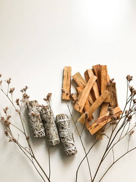 beautiful layout of palo santo and white sage, aromatherapy and incense on a white background. Place for text, religious minimalistic background - Fotó, kép
