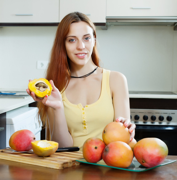 young woman with mango   - Foto, Imagem