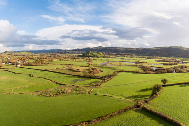 Green countryside panoramic view in Wales - Vivid colours with fields and green meadows on foreground - Nature and travel concepts - Foto, afbeelding