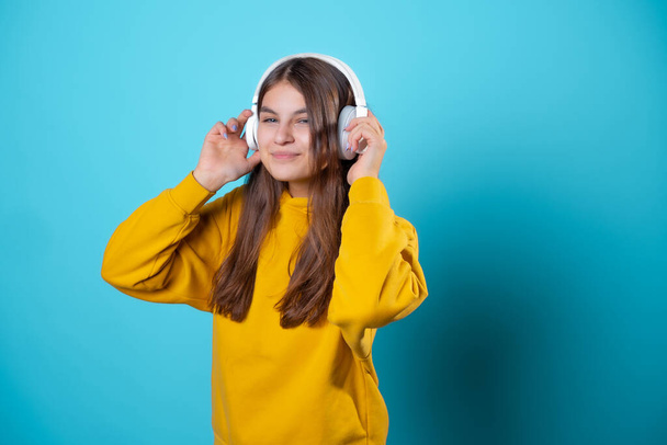 A music lover, A charming young woman with headphones, listens to music. - Foto, Bild