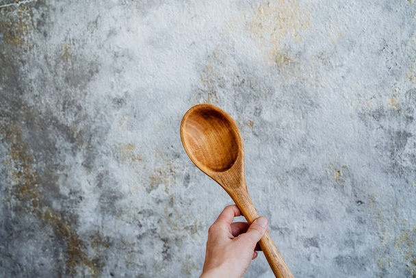 wooden spoon. a set of table items made of wood. carpenter cut spoons out of wood, handmade by the master carpenter. Kitchenware. High quality photo - Fotó, kép