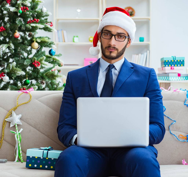 Businessman working at home during christmas - Foto, Imagem