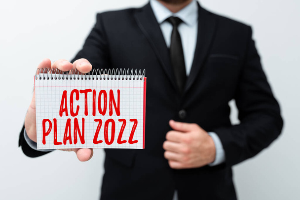 Текст, показывающий вдохновение План действий 2022. Предложенный бизнес-подход Стратегия или курс действий на текущий год Представление новых планов и идей Демонстрация процесса планирования - Фото, изображение