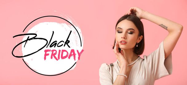 Beautiful woman with text BLACK FRIDAY on pink background - Photo, image