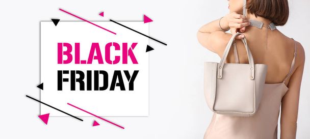 Beautiful woman with text BLACK FRIDAY on light background - Photo, Image