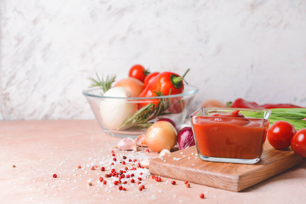 Bowl with organic tomato sauce on table - Photo, Image