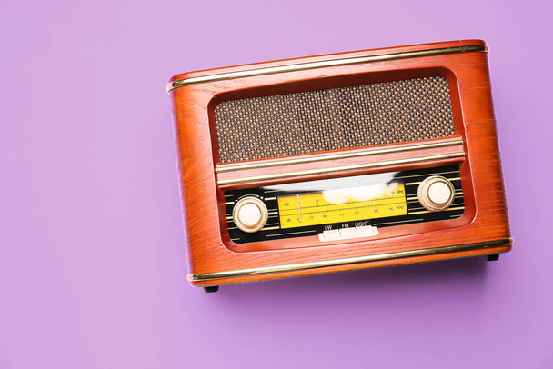Vintage radio receiver on color background - Photo, Image