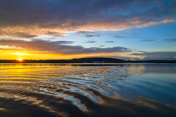 Sunrise, cloud and reflections at Woy Woy Waterfront on the Central Coast, NSW, Australia. - Valokuva, kuva