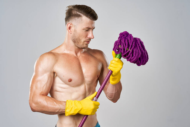 athletic man with a pumped-up torso in hands service posing - Photo, Image