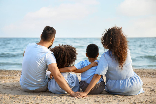 Happy family on sea beach - Фото, изображение