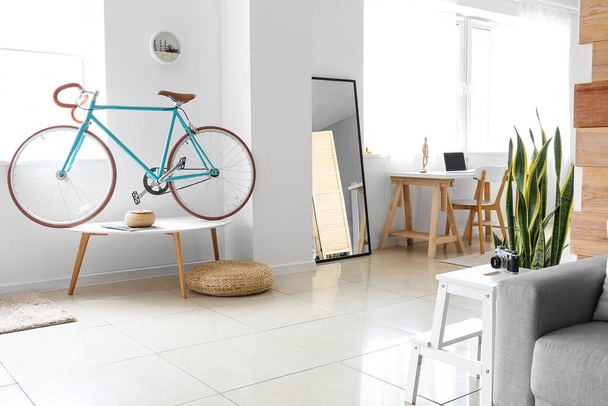 Comfortable interior of living room with modern bicycle - Photo, Image