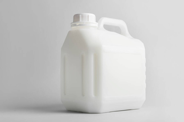 Gallon bottle of milk on light background - Photo, Image