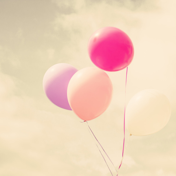 Colorful balloons over vintage sky - Foto, afbeelding
