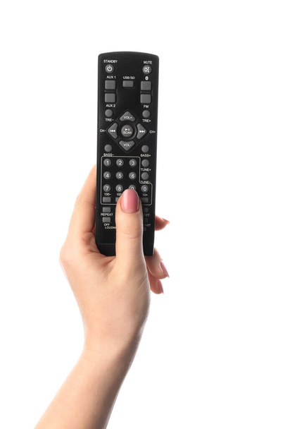 Female hand with TV remote controller on white background - Photo, Image