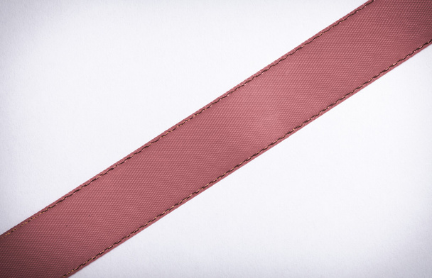 Red ribbon on white background copy space - Фото, зображення