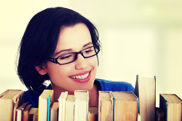 Happy smiling young student woman with books - Фото, изображение
