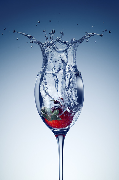 Strawberry in a glass with water. - Zdjęcie, obraz
