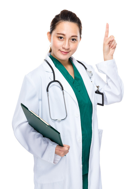 Asian woman doctor with clipboard and finger point up - Zdjęcie, obraz