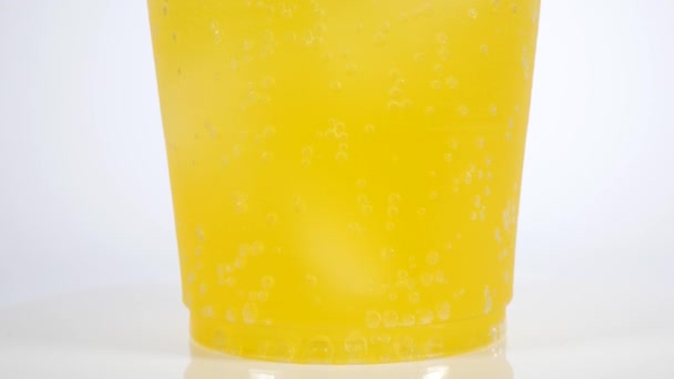 Narancssárga szóda műanyag pohár - Felvétel, videó