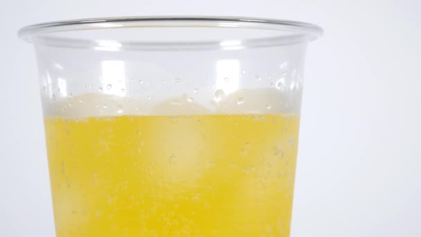 Narancssárga szóda műanyag pohár - Felvétel, videó