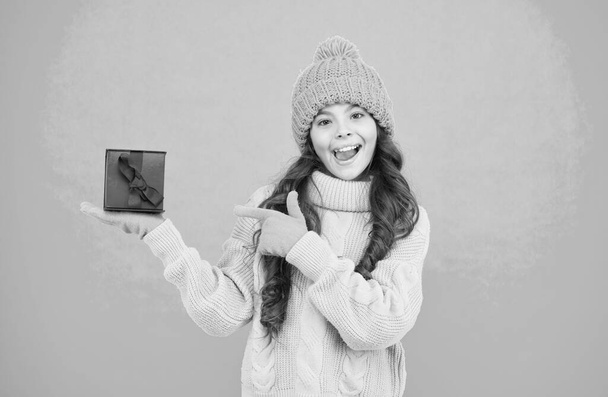 Shopping day. Child excited about unpacking her gift. Small cute girl received holiday gift. Enjoy receiving presents. Christmas gifts for kids. Kid little cheerful girl hat long hair hold gift box - Фото, изображение