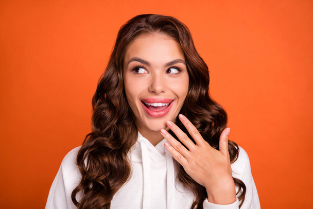 Photo of young pretty girl good mood flirty date look empty space isolated over orange color background. - Valokuva, kuva