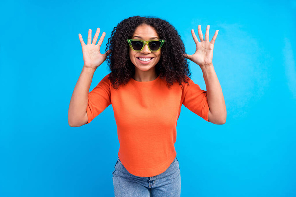 Photo of young african attractive woman happy positive smile have fun hands isolated over blue color background. - Foto, Bild
