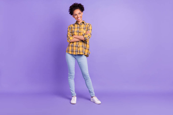 Full body photo of young african girl happy positive smile folded hands look empty space isolated over purple color background. - Fotó, kép